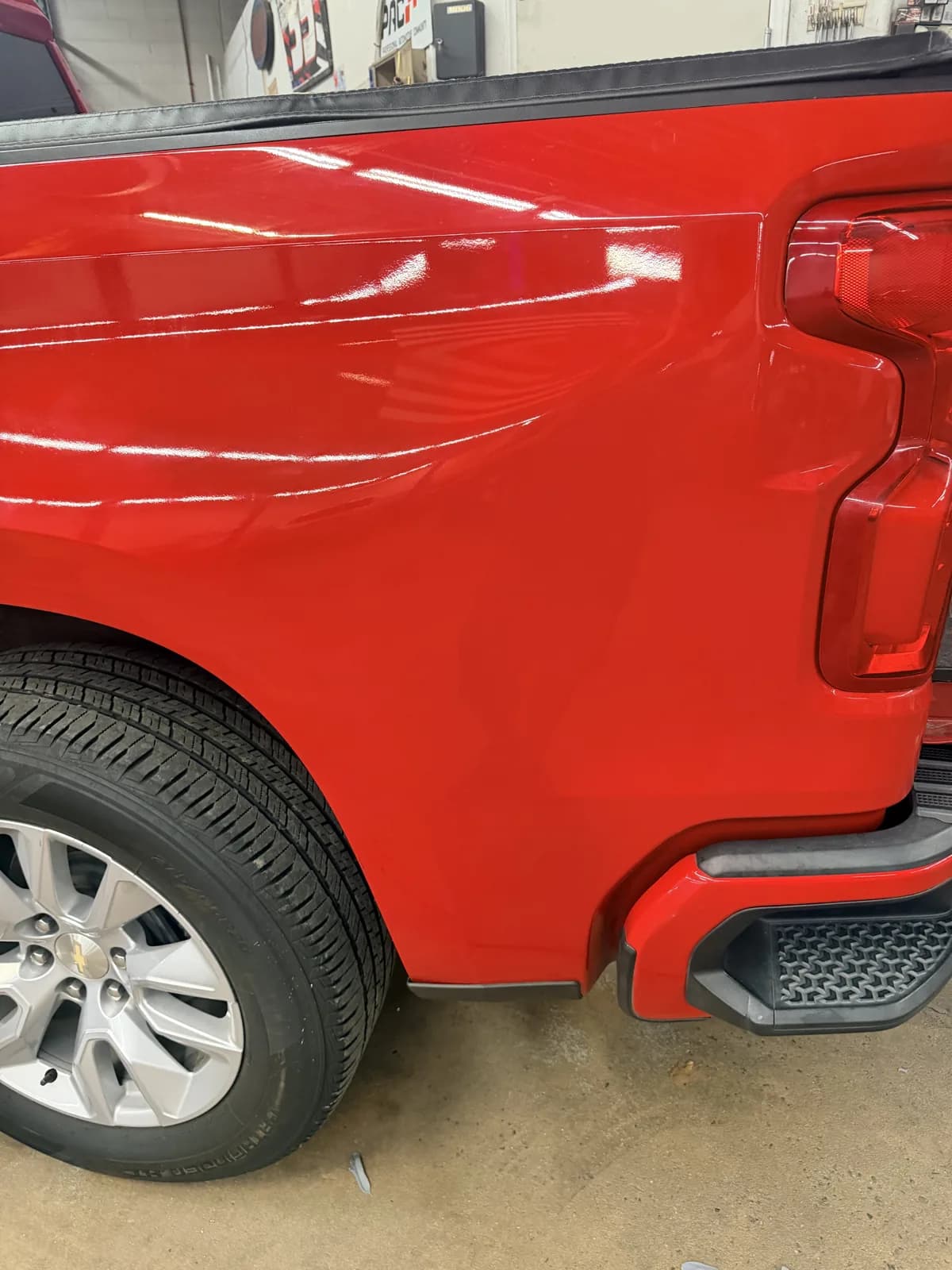 The same Silverado bedside after repair, body line restored.